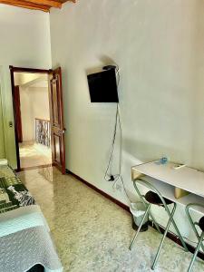 TV a/nebo společenská místnost v ubytování Casa Hotel Impacto