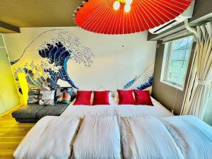 Krevet ili kreveti u jedinici u okviru objekta Hokusai's House Shibuya Dogenzaka 311