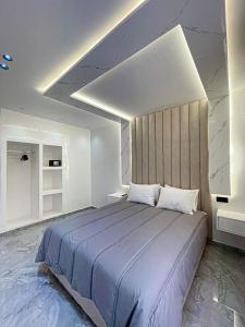a bedroom with a large bed in a room at TANGIER DUPLEX LUXURY apartment GUEST FRIENDLY B4 in Tangier