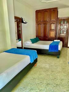 Postel nebo postele na pokoji v ubytování Casa Hotel Impacto