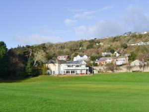 a view of a house from a golf green at Steephill Lodge in Saint Lawrence