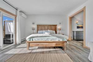 A bed or beds in a room at Ocean View East Duplex with Walk to Crescent Beach