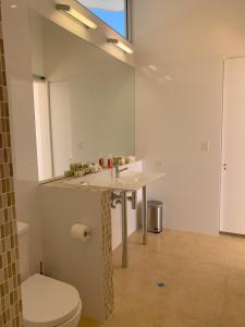 a bathroom with a sink and a toilet at Lush Pastures in Bald Hills