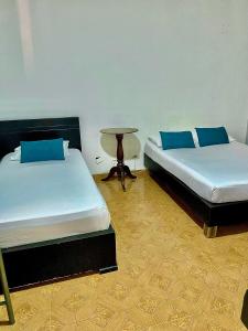 Postel nebo postele na pokoji v ubytování Casa Hotel Impacto