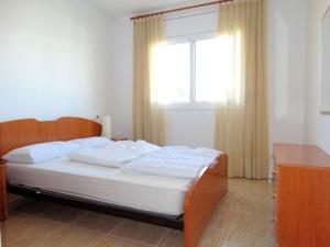 A bed or beds in a room at Haus TERANY