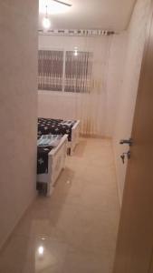 a hallway with two beds in a room at Apartment in Nador in Nador