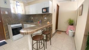 A kitchen or kitchenette at SUITE AMOBLADA TODO INCLUIDO