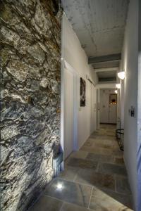 a hallway of a building with a stone wall at Hani Chrysomilou in Kalopanayiotis