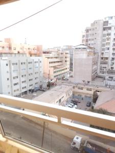 a view from a window of a city with buildings at F1 Cosy in Dakar
