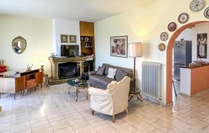 a living room with a couch and a fireplace at Nice Home In Theologos With Wi-fi in Theológos