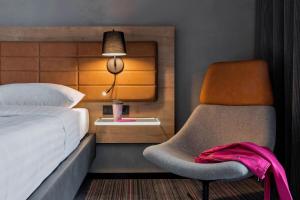 Cama ou camas em um quarto em Moxy Warsaw Praga