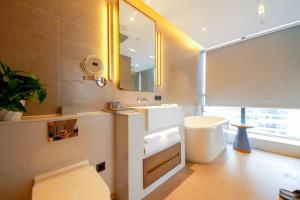 A bathroom at Changsha Zealandia Serviced Apartment