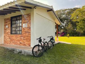 two bikes parked in front of a building at Finca la Flor del Café in Quimbaya
