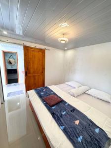 a small bedroom with a bed in a boat at Go Dieng Cabin 4 in Dieng