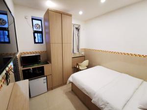 Kuchyňa alebo kuchynka v ubytovaní Hoi To Hostel
