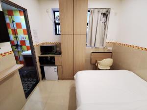 Posteľ alebo postele v izbe v ubytovaní Hoi To Hostel