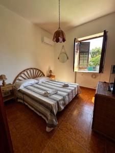 a bedroom with a large bed in a room at Villa Gelsomini in Carini