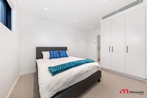 En eller flere senge i et værelse på MetaWise Luxury Haven 4 Bed in Central Double Bay