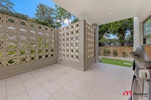 an empty patio with a wall with plates on it at MetaWise Luxury Haven 4 Bed in Central Double Bay in Sydney