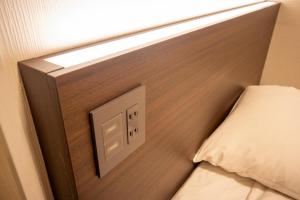 Postel nebo postele na pokoji v ubytování Hotel Aisul Matsuyama