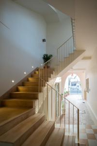 a staircase in a house with wooden floors at Rajan House in Jaipur