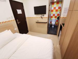 Posteľ alebo postele v izbe v ubytovaní Hoi To Hostel
