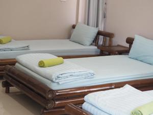 Postel nebo postele na pokoji v ubytování บ้านชมเขา - Baan Chom Khao