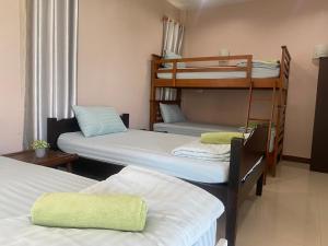 Postel nebo postele na pokoji v ubytování บ้านชมเขา - Baan Chom Khao + 37 fotografií