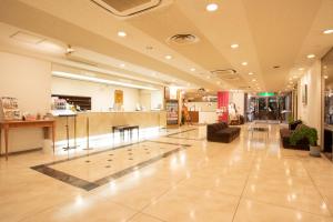 a lobby of a store with a bar in it at Hotel Sunroute Matsuyama in Matsuyama