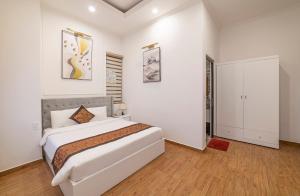 Ein Bett oder Betten in einem Zimmer der Unterkunft Bảo Duy 4 Hotel
