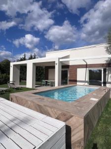 a swimming pool in the backyard of a house at Respiro Greco in Syracuse