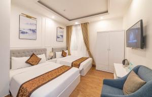 Säng eller sängar i ett rum på Bảo Duy 4 Hotel