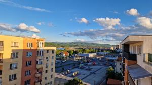 an aerial view of a city with buildings at Modern Apartament with a view in Râmnicu Vâlcea