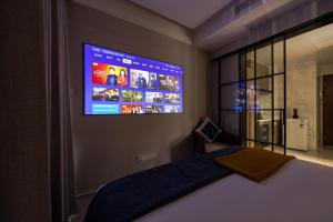 Giường trong phòng chung tại Xi Ke Executive Apartment - Shenzhen Futian Exhibition Center