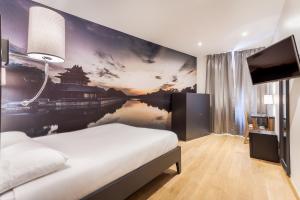 Postel nebo postele na pokoji v ubytování Hotel Jenner