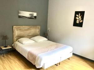 Postel nebo postele na pokoji v ubytování le rivalet