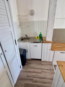 Kuchyň nebo kuchyňský kout v ubytování Résidence Punta paliagi