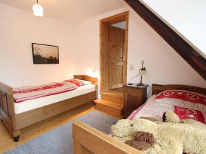 a bedroom with two beds and a mirror at Beautiful holiday apartment in Dorfmark in Dorfmark