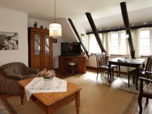 a living room with a couch and a table at Wohnung in Dorfmark nahe Lüneburger Heide in Dorfmark