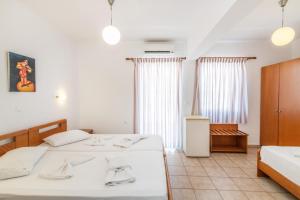 Postel nebo postele na pokoji v ubytování Ageri Hotel