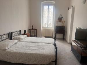 Ένα ή περισσότερα κρεβάτια σε δωμάτιο στο Rossese di sera