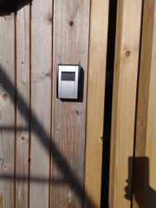 a wooden wall with a electrical box on it at Haus Abendrot in Dornbirn