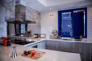 a kitchen with a sink and a counter top at Can Javi de Palma - Amazing villa with swimming pool in La Mola