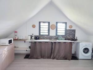 Kuchyň nebo kuchyňský kout v ubytování T1 - O' relax + 3 fotografie