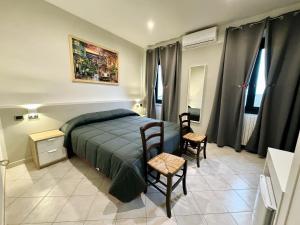 Voodi või voodid majutusasutuse Hotel Duca di Tromello toas