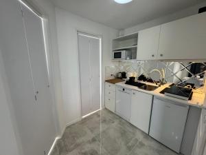Kuchyň nebo kuchyňský kout v ubytování Apartament Słoneczny