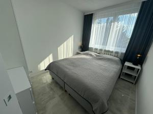 Postel nebo postele na pokoji v ubytování Apartament Słoneczny