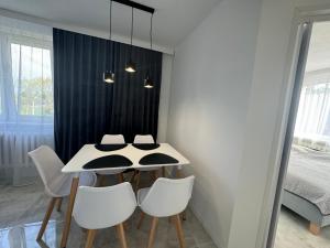 Postel nebo postele na pokoji v ubytování Apartament Słoneczny