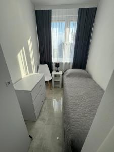 Postel nebo postele na pokoji v ubytování Apartament Słoneczny