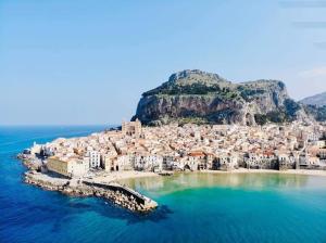 an aerial view of a town on an island in the water at Casa Rosellina in Cefalù